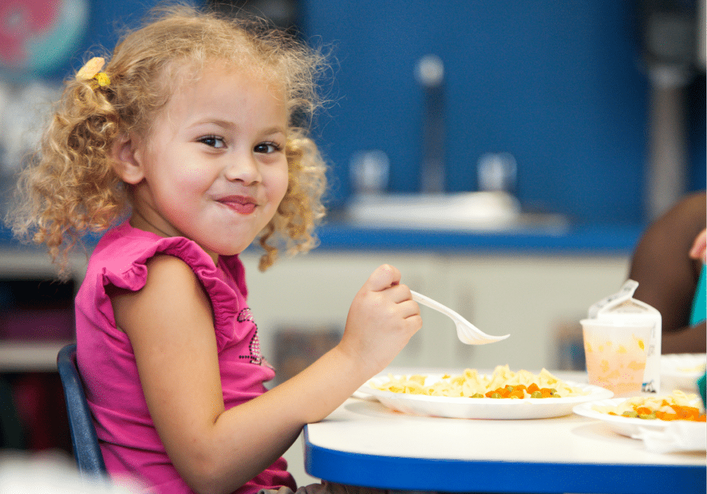 Little girl eating lunch